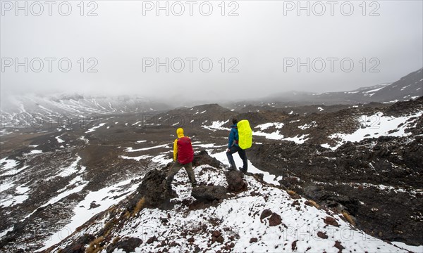 Hikers standing on stones
