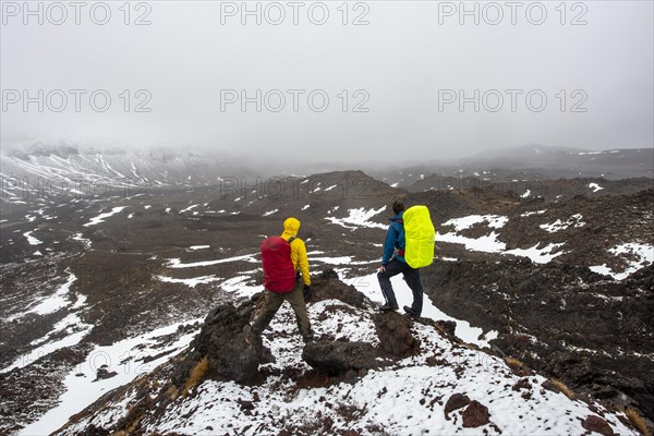 Hikers standing on stones