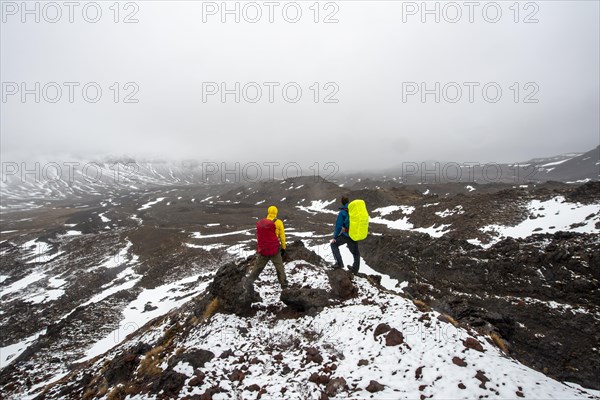 Hikers standing on stones