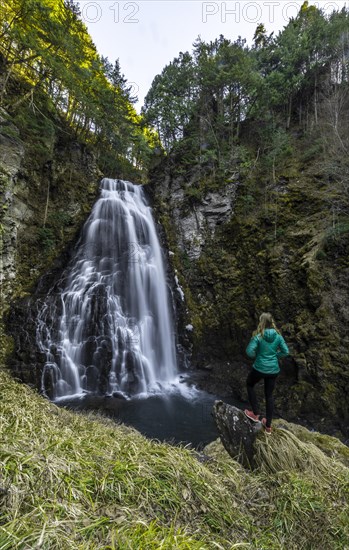 Woman standing in front of Bandokoro Waterfall