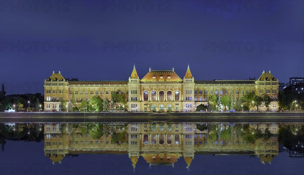 University with reflection in the Danube