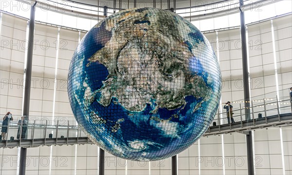 Big globe hangs from the ceiling