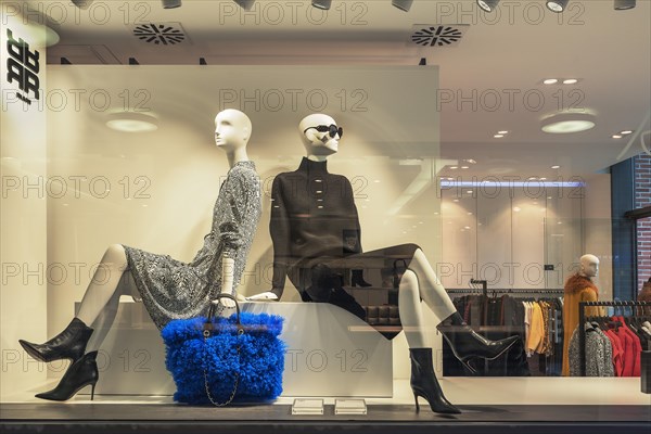 Shop window with fashion dolls