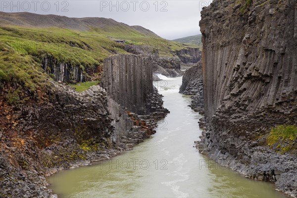Studlagil gorge with basalt columns and glacial river Jokulsa a Bru