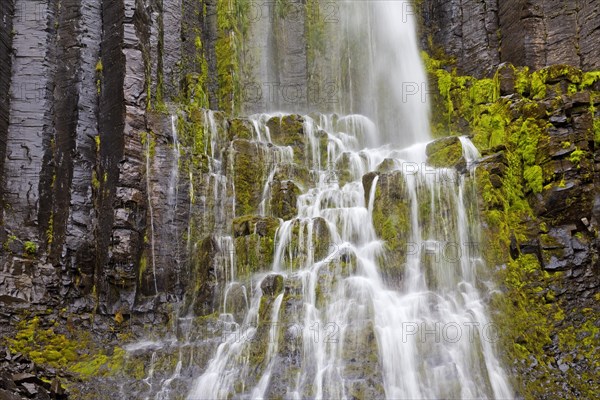 Waterfall over mossy rocks