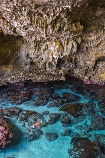 Tourist snorkeling in the Avaiki rock tide pools