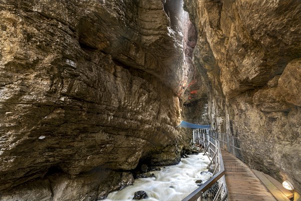 River Weisse Luetschine flows through Grindelwald glacier gorge