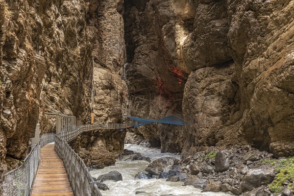 River Weisse Luetschine flows through Grindelwald glacier gorge