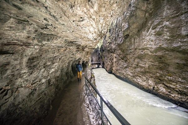 Young man in the Aareschlucht gorge in the Haslital