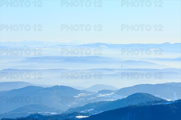 View from the summit of the Belchen to snow-covered mountain and alpine ranges