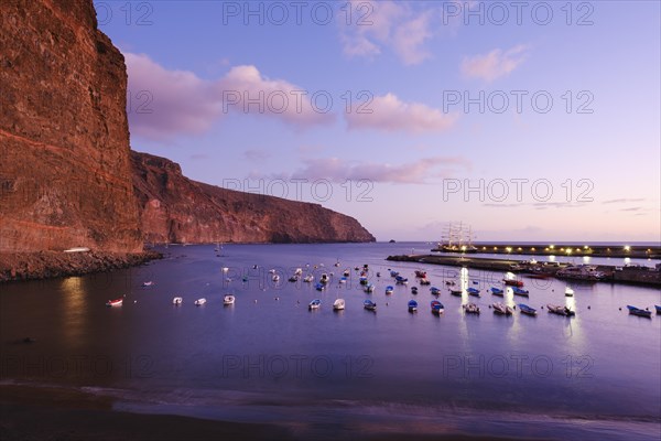 Fishing boats in the fishing port at dusk