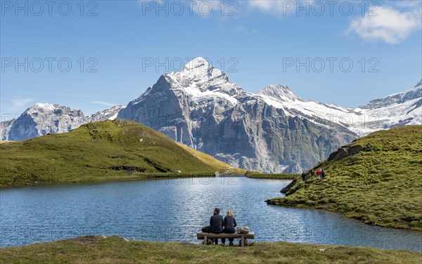Hikers resting on a bench