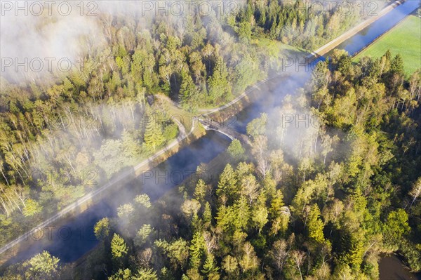 Wafts of fog over the Isar-Loisach Canal near Geretsried