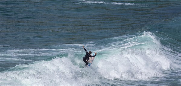 Surfers in the bay of Minou