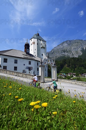 Cyclists in front of the pilgrimage church Mariastein