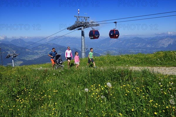 Family hiking on the summit panorama trail of the Hohe Salve