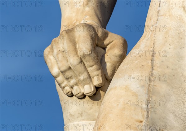 Close-up of hand of athlete statue at Stadio dei Marmi