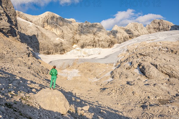 Hiker looks at alpine landscape