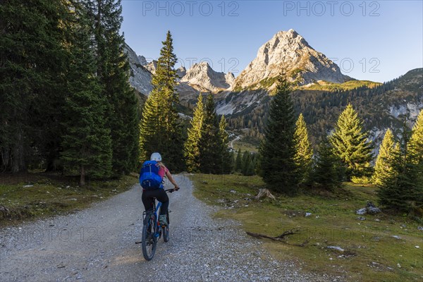 Mountain biker on gravel road to Seebensee