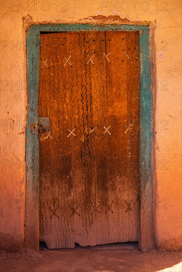 Entrance made of cactus wood with animal tendons