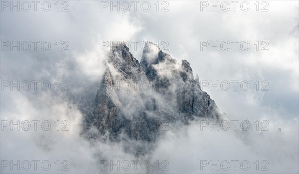 Cloud-covered rocky peaks