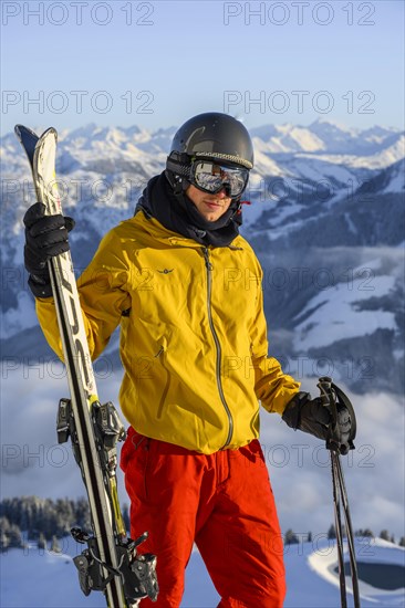 Skier in front of mountain panorama