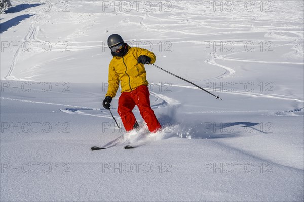 Skiers in deep snow