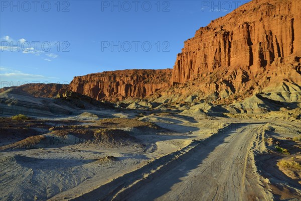 Track in front of a red rock face