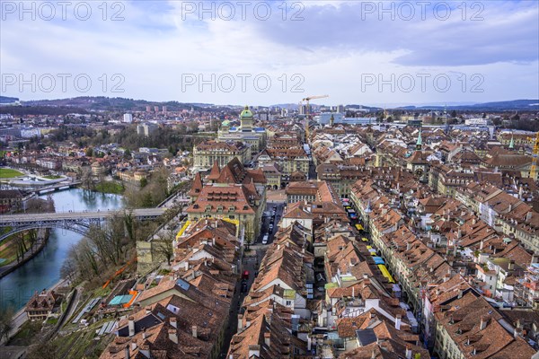 View from Bern Cathedral to the red tiled roofs of the houses in the historic city centre of the old town and river Aare