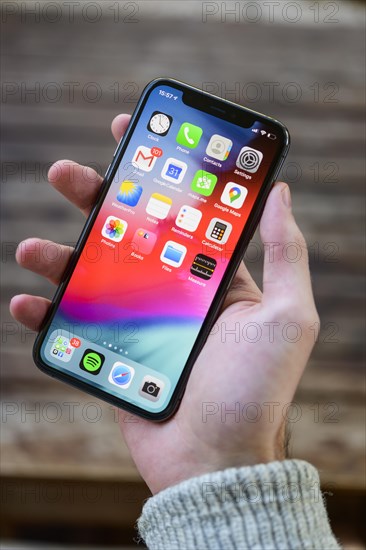 Hand holding iPhone 11