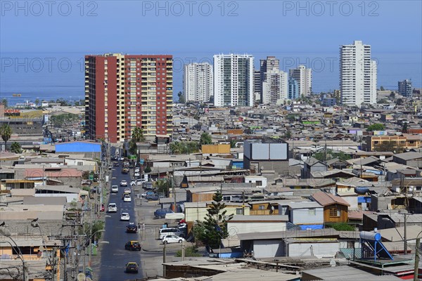 Typical simple residential buildings in front of skyscrapers