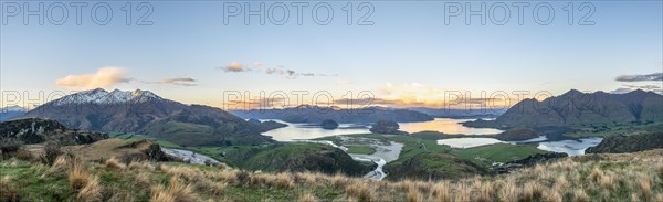 Sunset, panorama view on Wanaka Lake and mountains