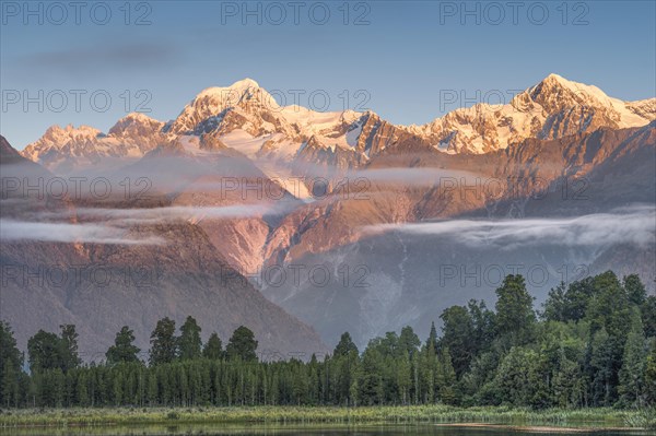 Snowy mountain peaks Mount Cook and Mount Tasman in the evening light, Westland National Park