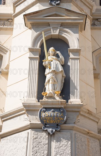 Figure of Justitia with sword, scales and blindfold