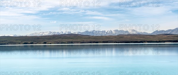 Blue glacier lake Lake Pukaki with mountain range, Mount Cook National Park