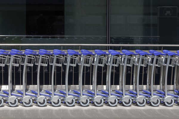 Long row of baggage trolleys at Duesseldorf airport, airport trolley