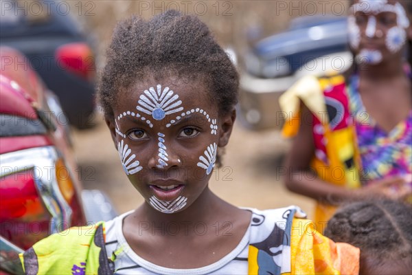 Native young girl with traditional face painting, Diego Suarez