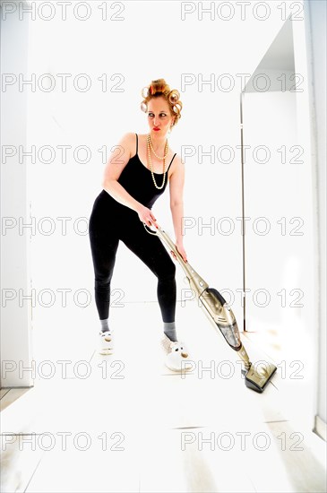 Woman vacuum cleaning