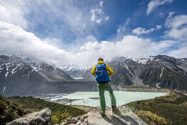 Hiker stands on rocks