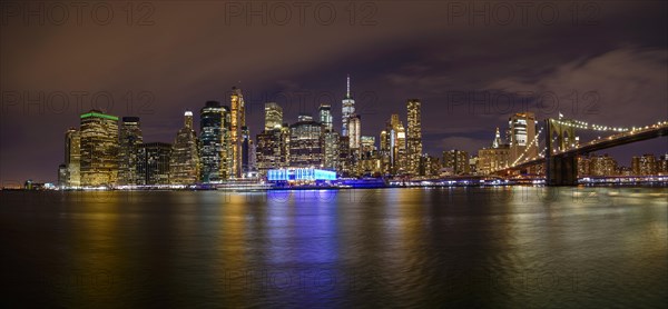 View from Pier 1 at night over the East River to the skyline of lower Manhattan