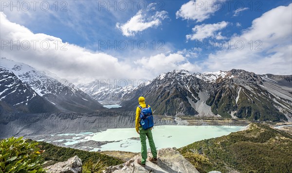 Hiker stands on rocks