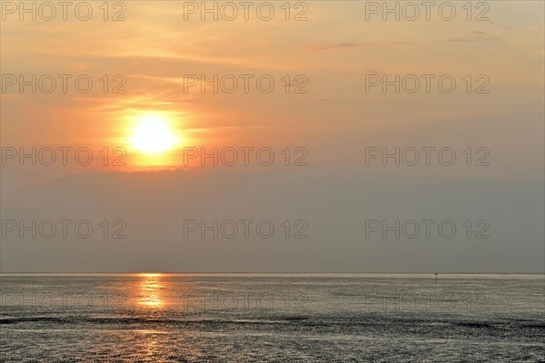 Sunset at the Wadden Sea at low tide