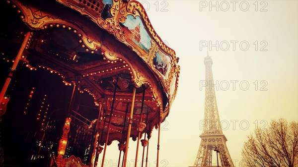 Old carousel in the park near Eiffel Tower