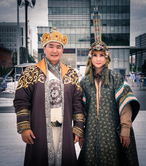Mongolian family is posing in traditional costumes during the DEEL