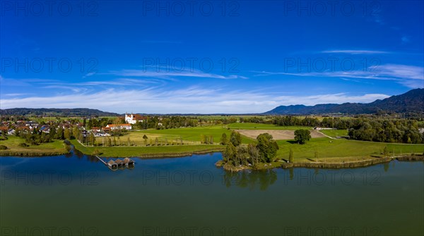 Aerial view of Schlehdorf Monastery with St. Tertulin Parish Church at Lake Lake Kochel
