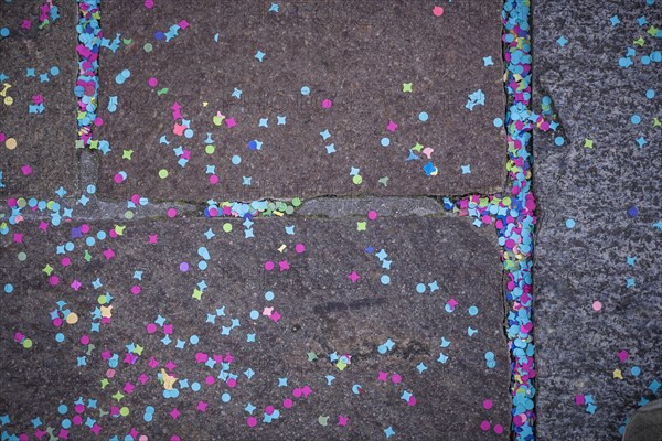 Colourful confetti after a carnival procession in the street