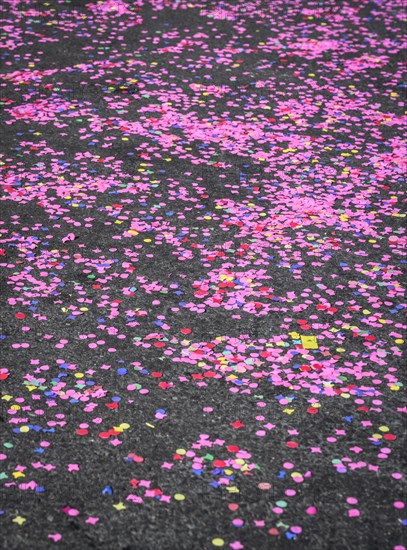 Colourful confetti after a carnival procession in the street