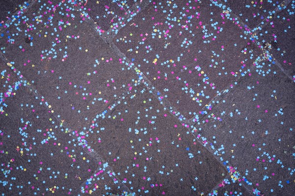 Colourful confetti after a carnival procession in the street