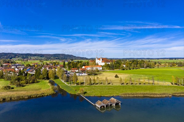 Aerial view of Schlehdorf Monastery with St. Tertulin Parish Church at Lake Lake Kochel