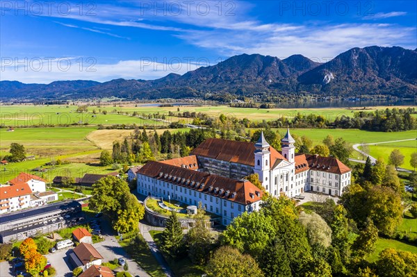 Aerial view of Schlehdorf Monastery with St. Tertulin Parish Church at Lake Lake Kochel